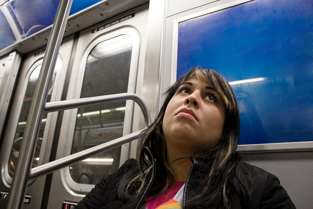 -young-woman-with-a-pensive-expression-on-her-face-riding-on-the-subway